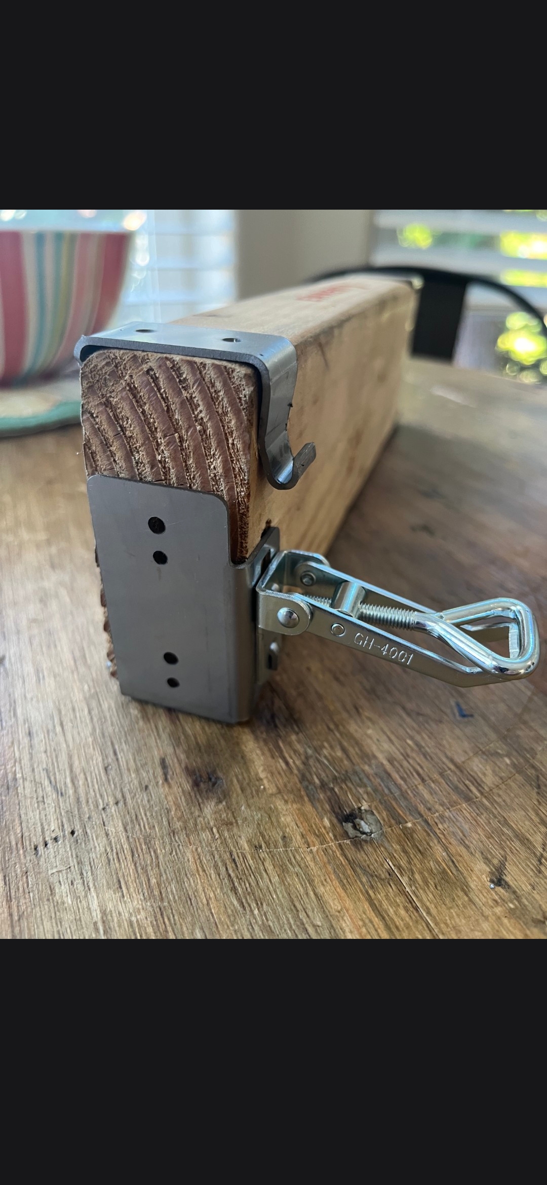 Close-up of the BITE BRACKET steel body and over-center toggle latch